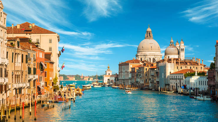 Canal in Italy with buildings lining the side