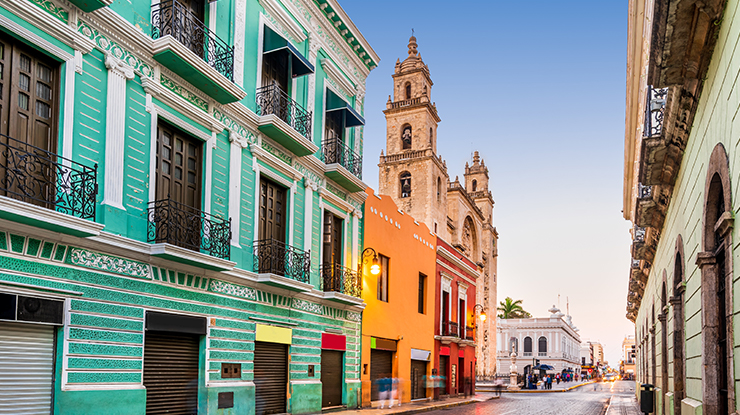 Mierda Mexico, street with colorful building on either side